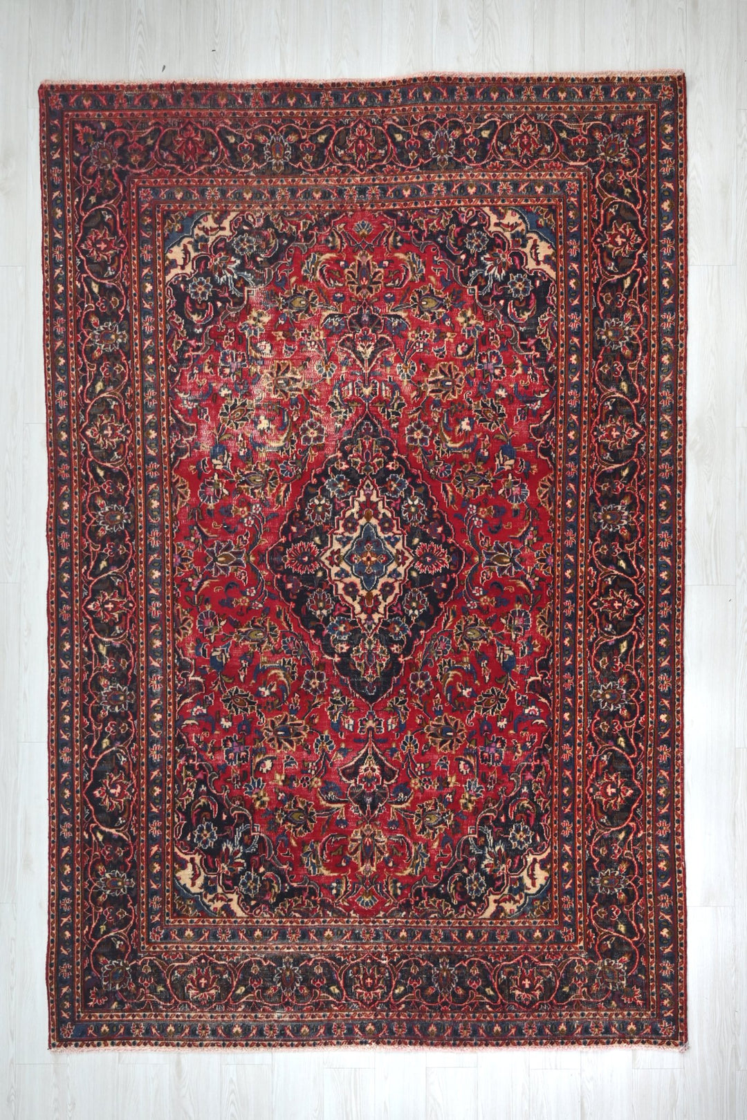 red Medium rug 6' 3" x 9' 0"