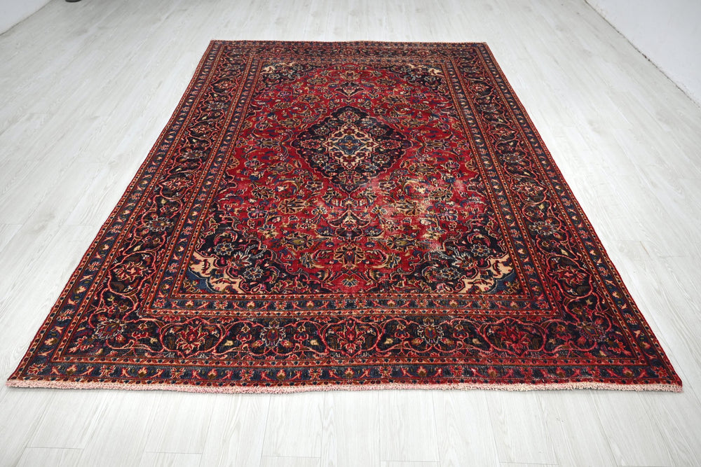 red Medium rug 6' 3" x 9' 0"