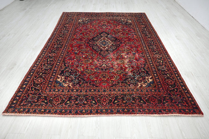red Medium rug 6' 3" x 9' 0"