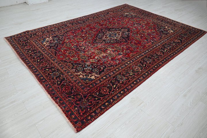 red Medium rug 6' 3" x 9' 0"