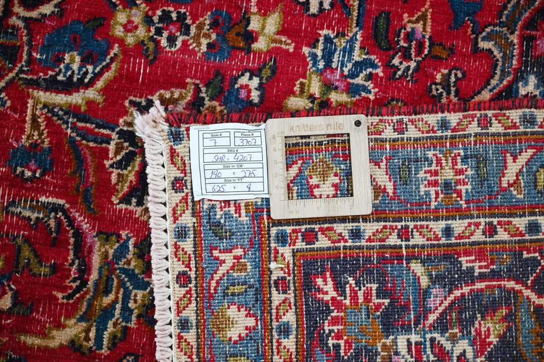 red Medium rug 6' 3" x 9' 0"