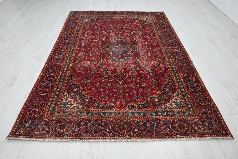 red Medium rug 5' 10" x 9' 0"