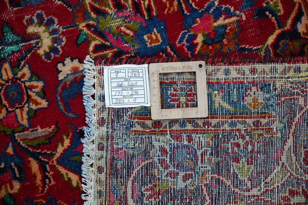 red Medium rug 5' 10" x 9' 0"