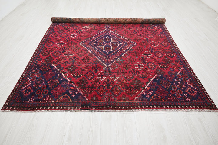 red Large rug 6' 9" x 9' 0"