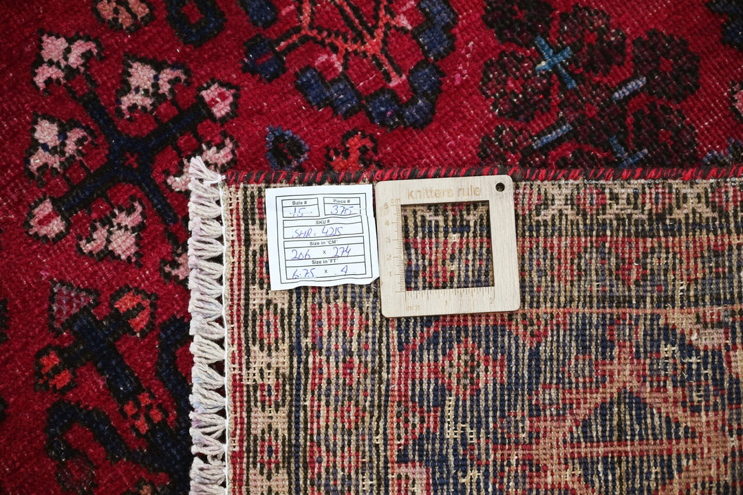 red Large rug 6' 9" x 9' 0"