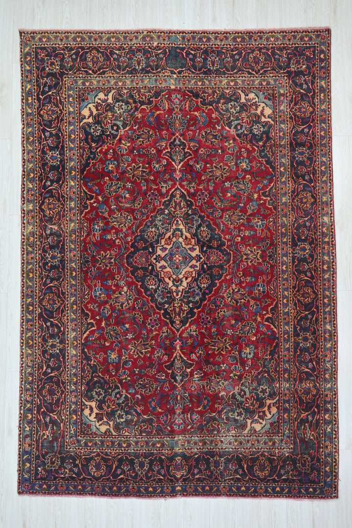 red Medium rug 6' 3" x 9' 0"