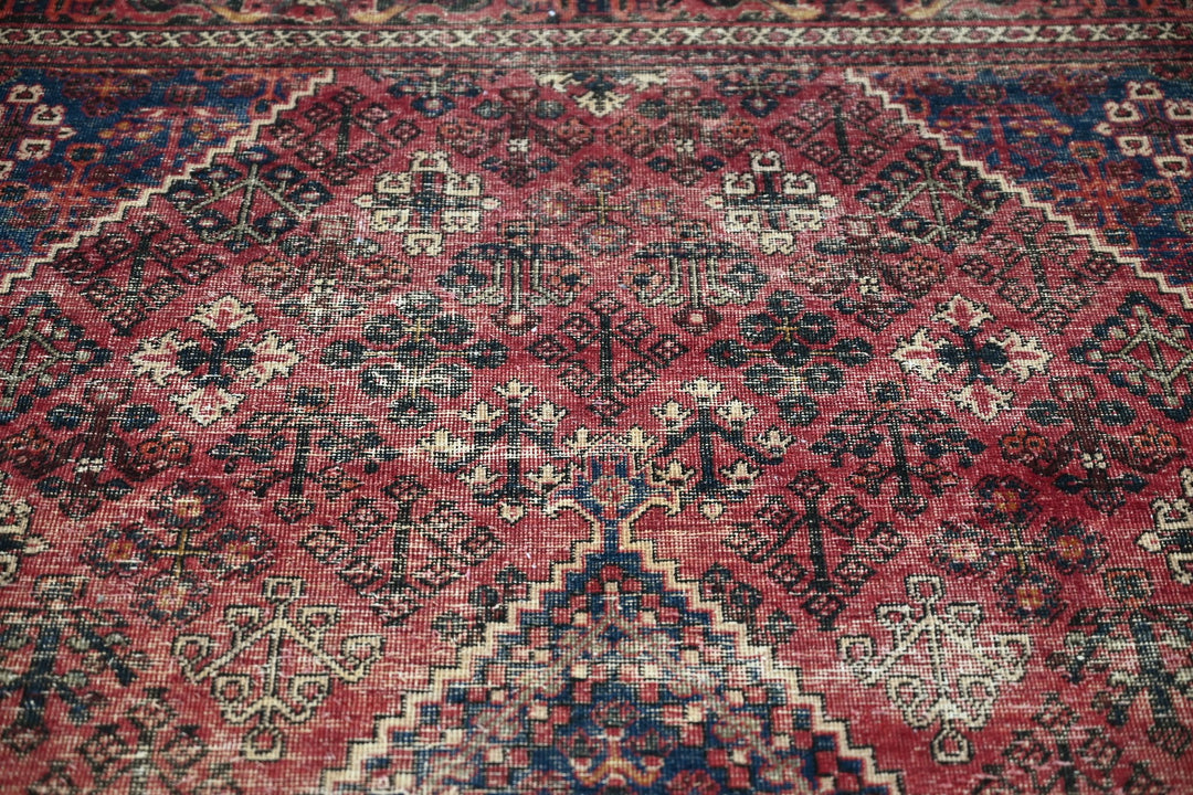 red Medium rug 6' 6" x 9' 0"