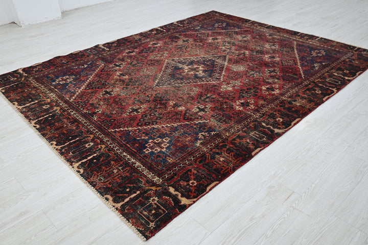 red Medium rug 6' 6" x 9' 0"