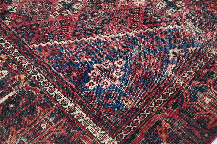 red Medium rug 6' 6" x 9' 0"