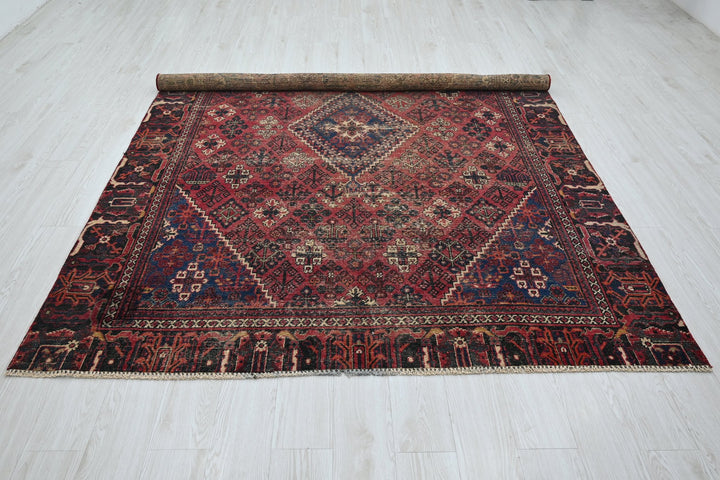 red Medium rug 6' 6" x 9' 0"