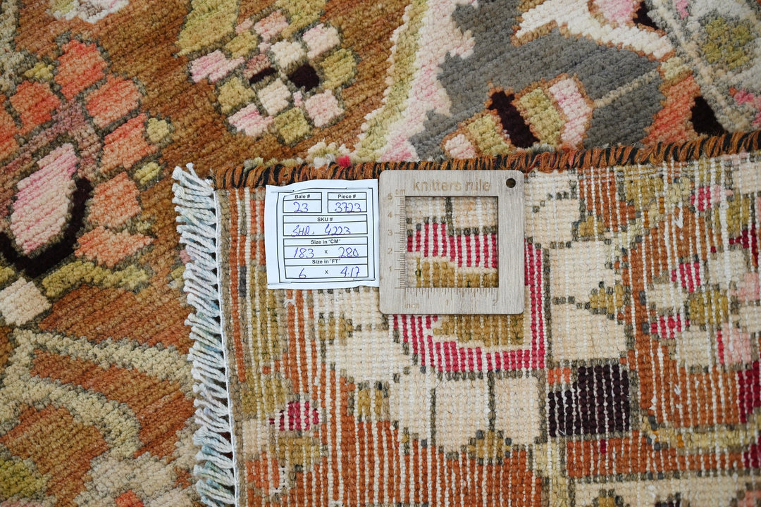 brown Medium rug 6' 0" x 9' 2"