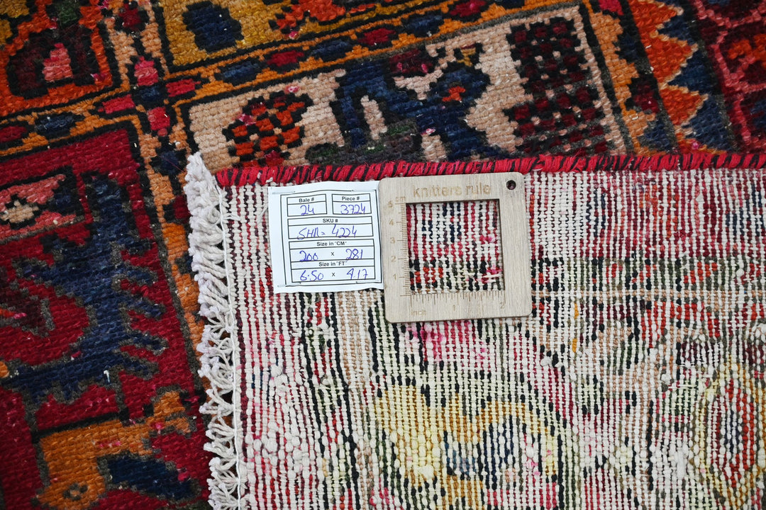 red Large rug 6' 7" x 9' 3"