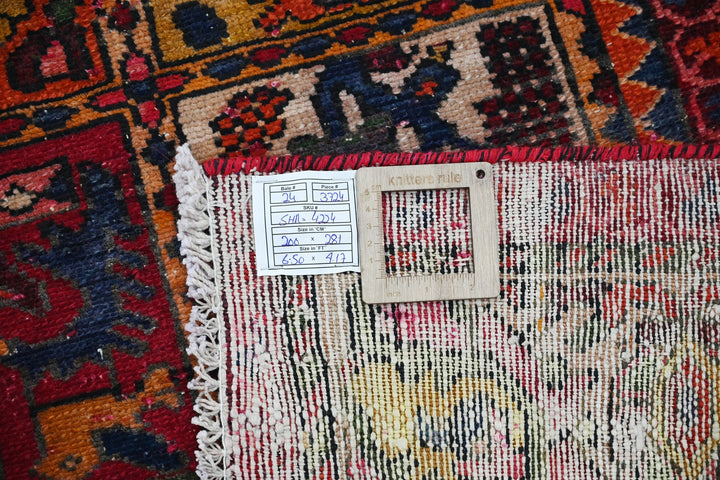 red Large rug 6' 7" x 9' 3"