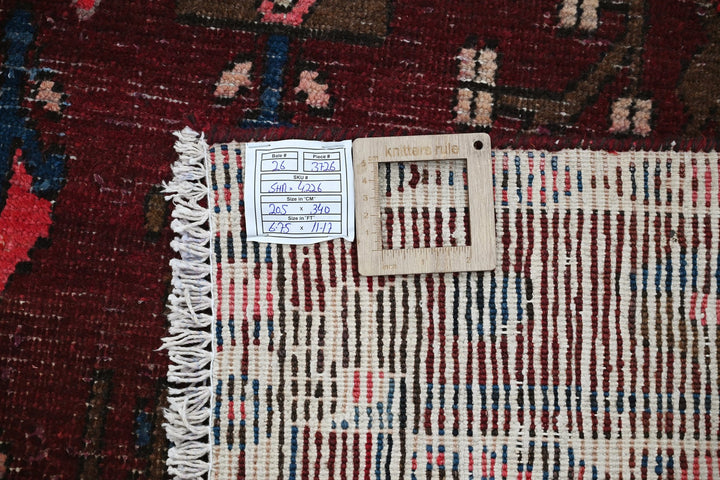 red Large rug 6' 9" x 11' 2"