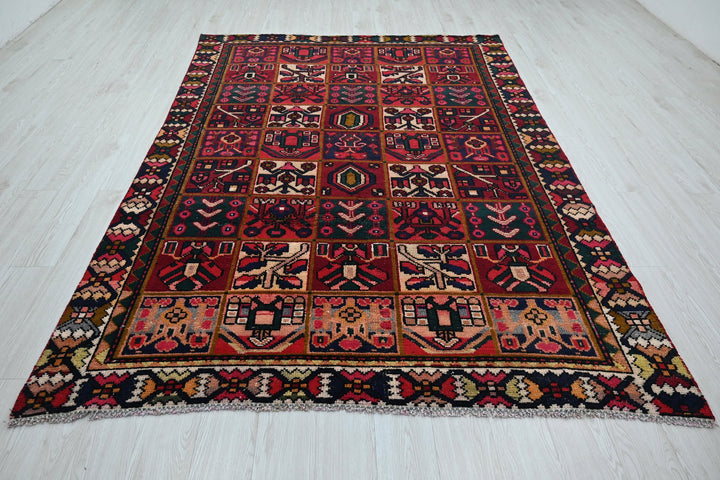 red Medium rug 6' 2" x 9' 0"
