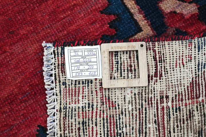 red Medium rug 5' 10" x 9' 1"