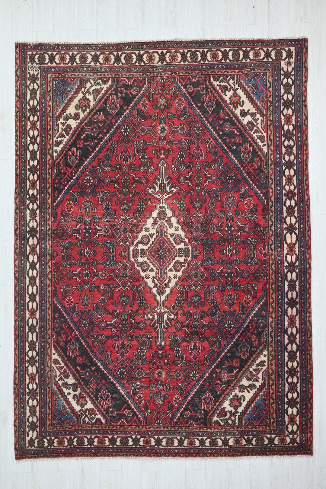 red Large rug 6' 11" x 9' 10"