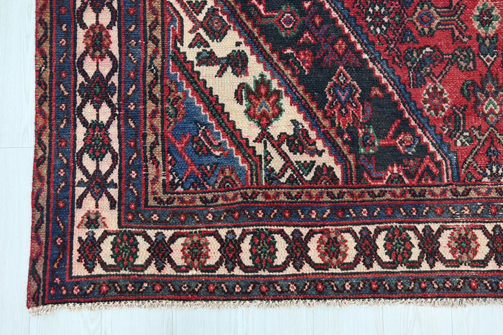 red Large rug 6' 11" x 9' 10"