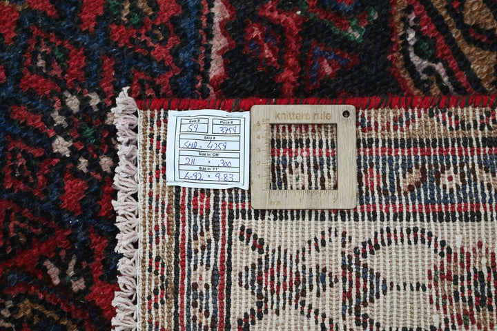red Large rug 6' 11" x 9' 10"