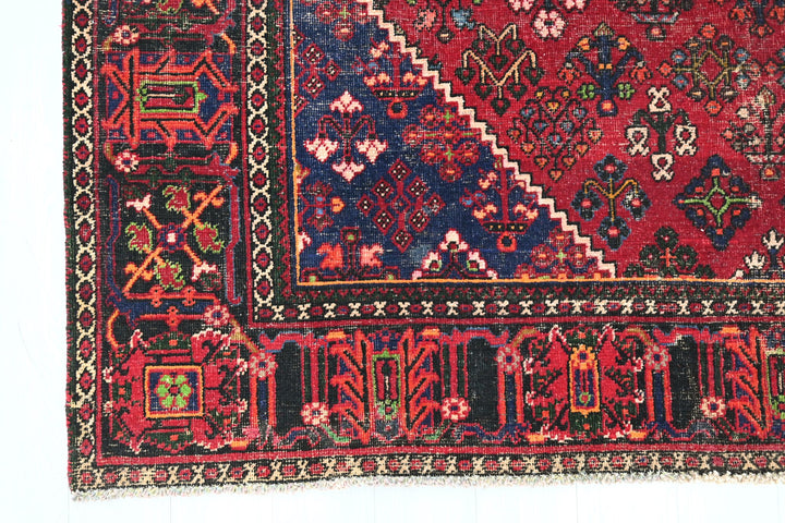 red Large rug 7' 0" x 9' 10"