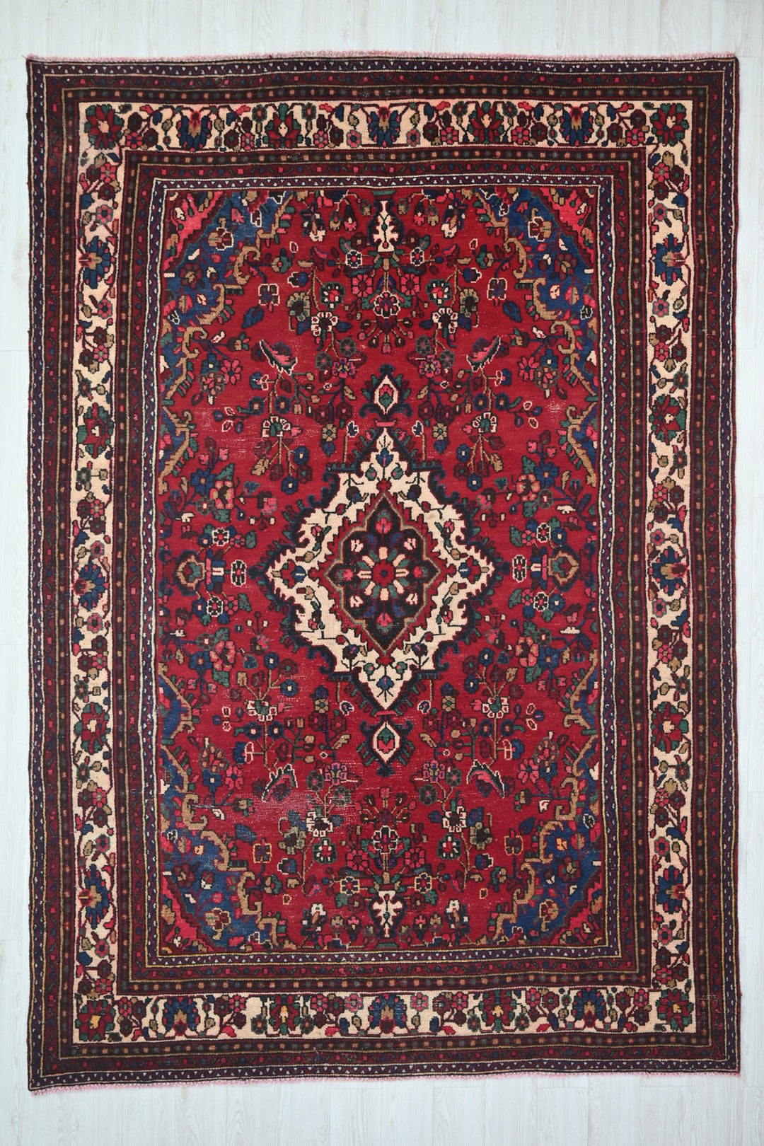 red Large rug 6' 11" x 10' 5"