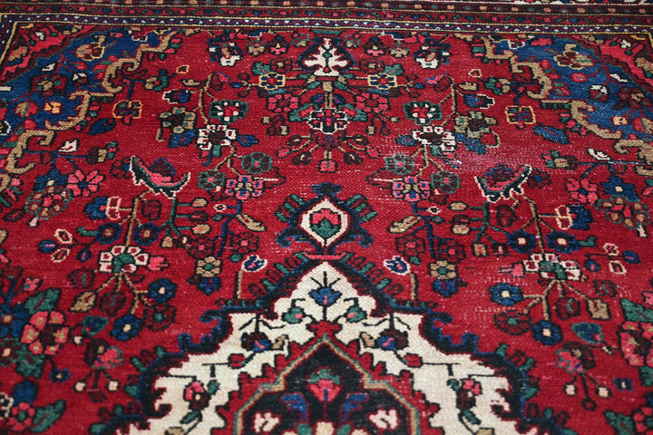 red Large rug 6' 11" x 10' 5"