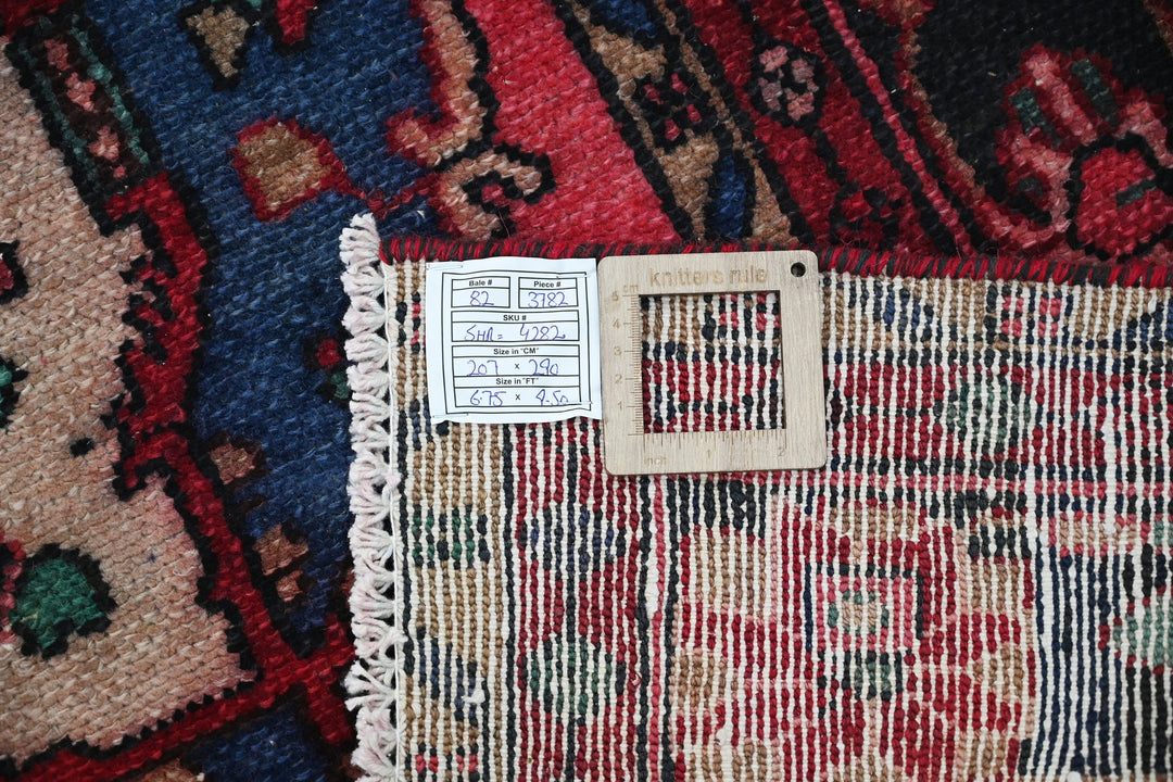 red Large rug 6' 9" x 9' 6"