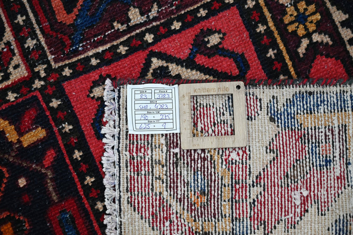 red Medium rug 6' 3" x 9' 0"
