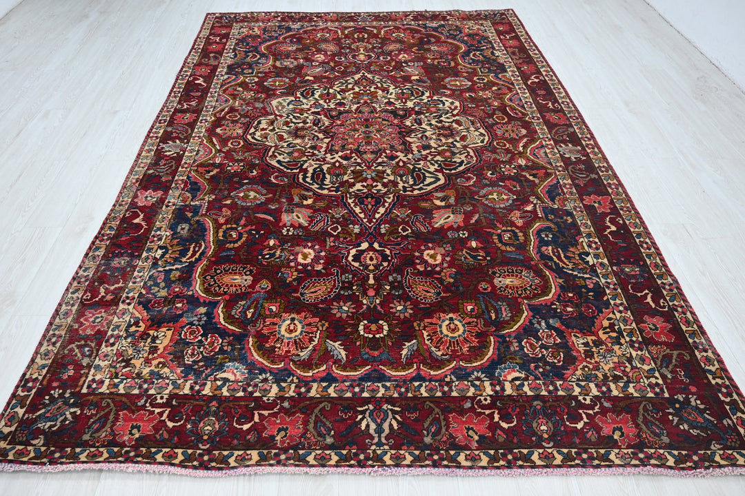 red Large rug 6' 11" x 10' 7"
