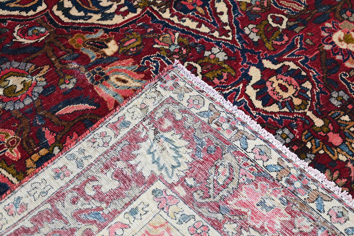 red Large rug 6' 11" x 10' 7"