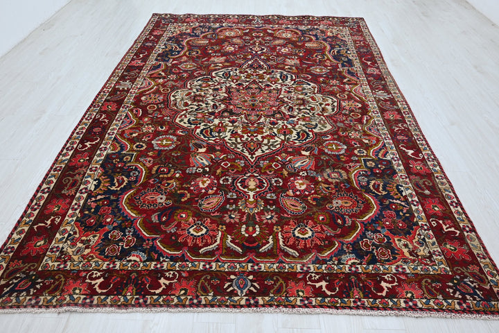 red Large rug 6' 11" x 10' 7"