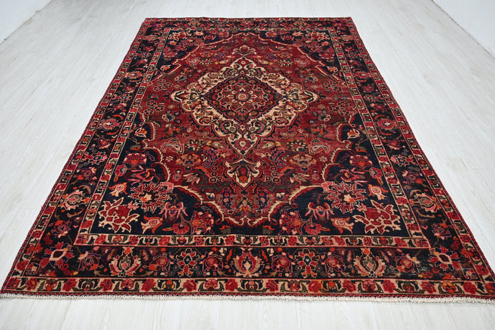 red Large rug 6' 11" x 10' 1"