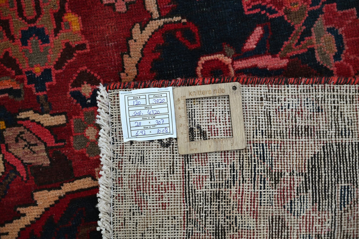 red Large rug 6' 11" x 10' 1"