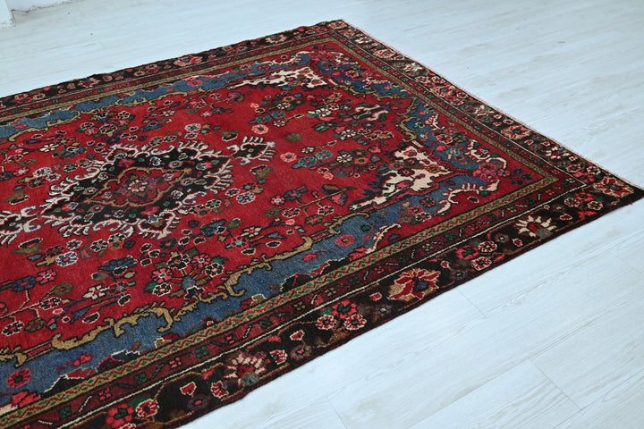 red Medium rug 6' 2" x 9' 0"