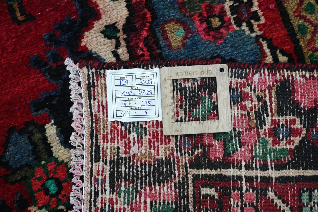 red Medium rug 6' 2" x 9' 0"