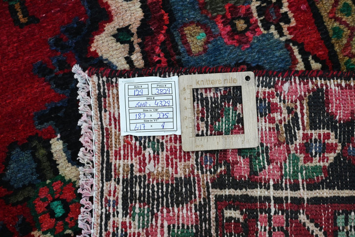 red Medium rug 6' 2" x 9' 0"
