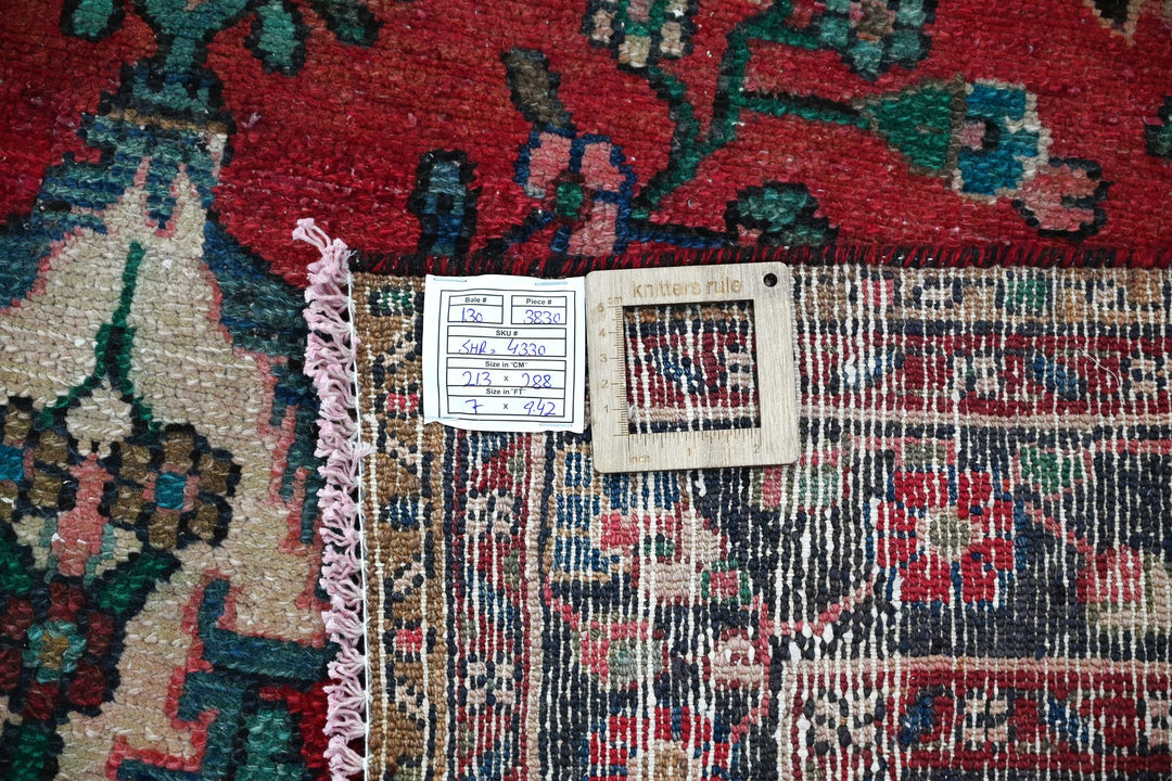 red Large rug 7' 0" x 9' 5"