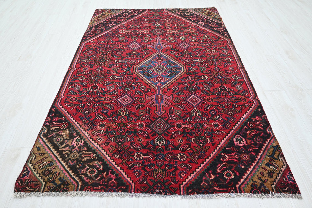 red Medium rug 4' 8" x 7' 3"