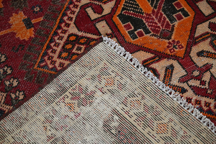 red Large rug 5' 0" x 9' 7"