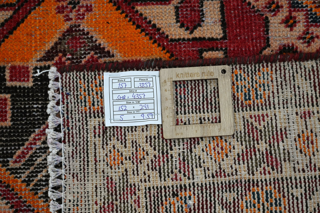 red Large rug 5' 0" x 9' 7"