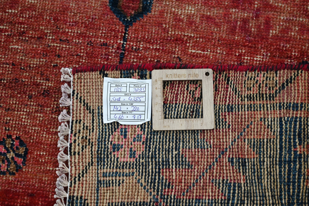 red Medium rug 4' 8" x 9' 2"