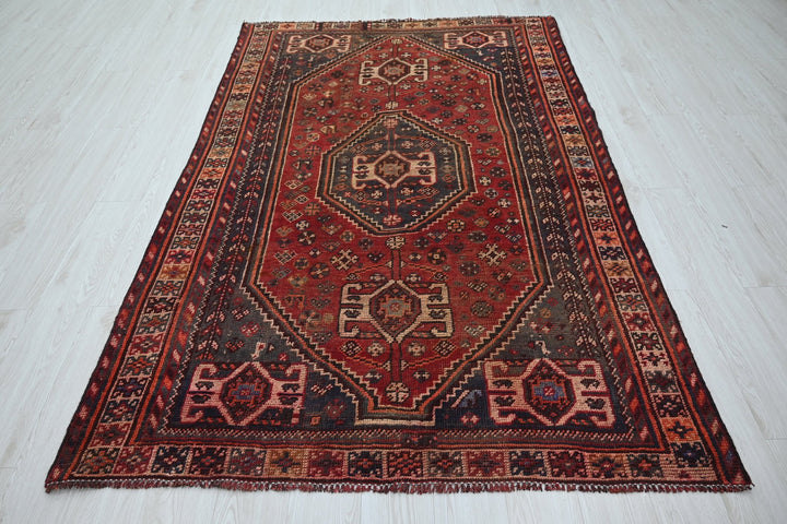 red Medium rug 5' 0" x 7' 9"
