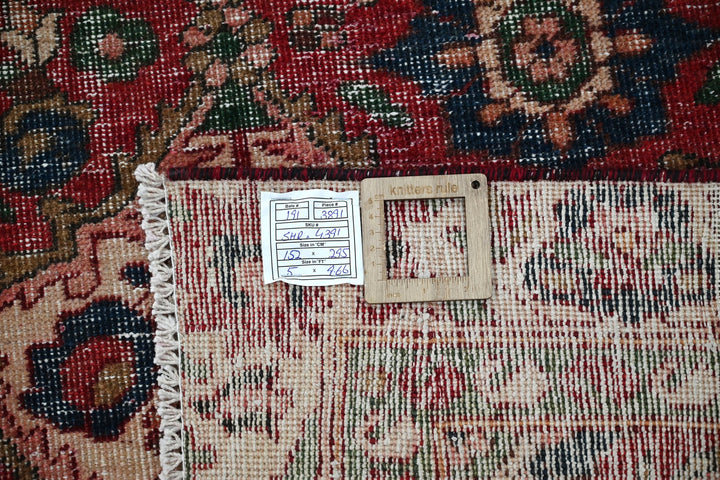red Large rug 5' 0" x 9' 8"