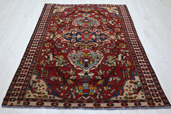 red Medium rug 4' 8" x 6' 7"