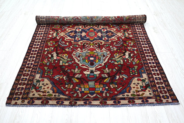 red Medium rug 4' 8" x 6' 7"
