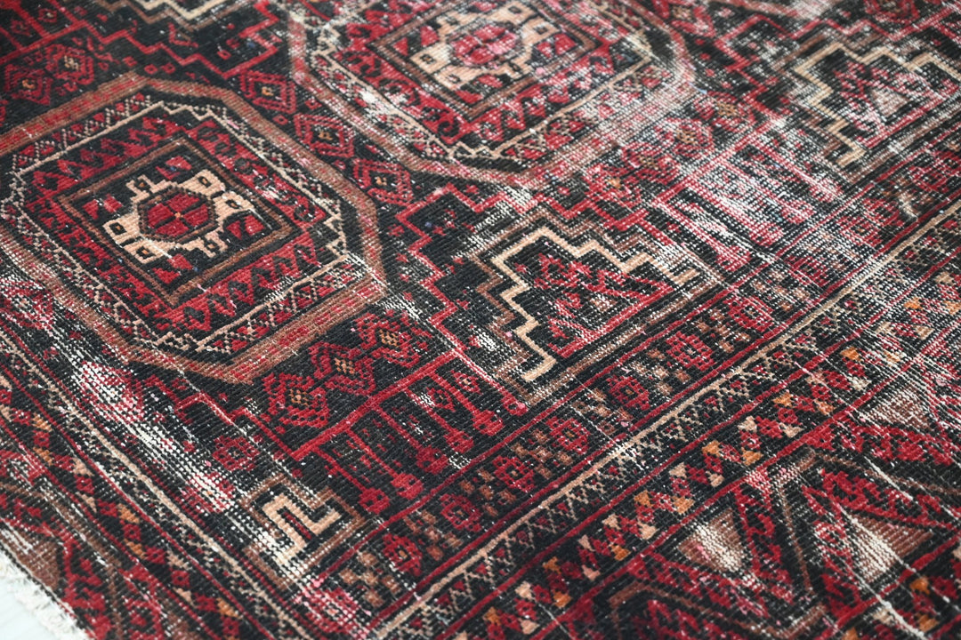 red Medium rug 3' 9" x 7' 0"