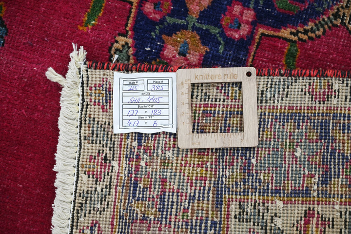 red Accent rug 4' 2" x 6' 0"