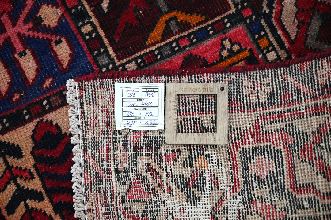 red Accent rug 4' 3" x 6' 4"