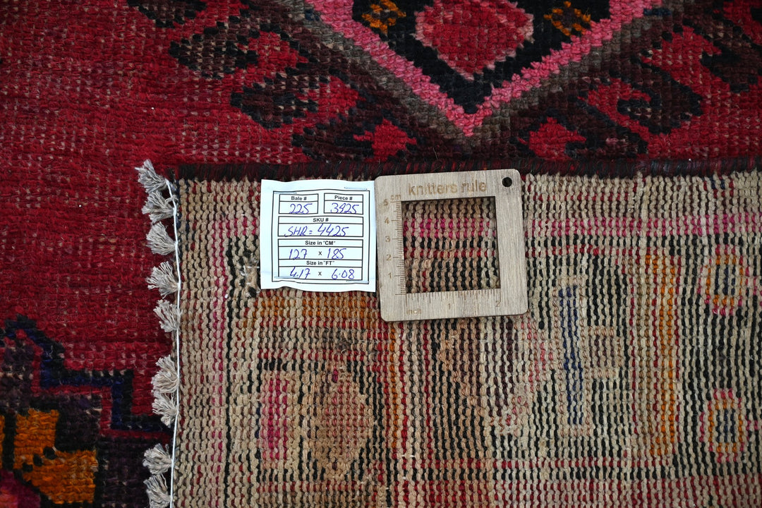 red Accent rug 4' 2" x 6' 1"