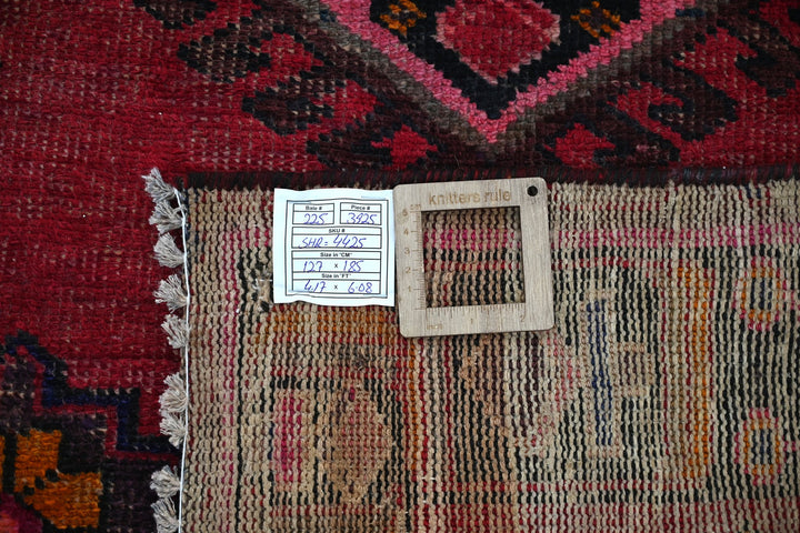 red Accent rug 4' 2" x 6' 1"